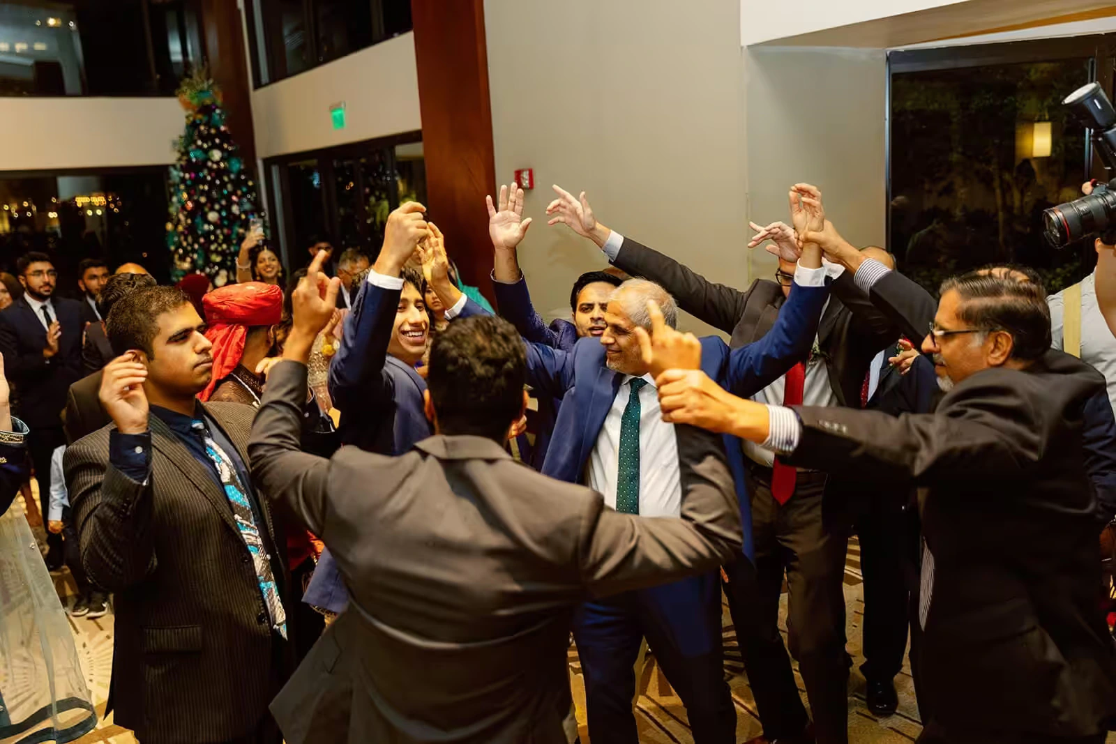 Newark Indian wedding DJ — South Asian wedding guests on packed dance floor with Bollywood music