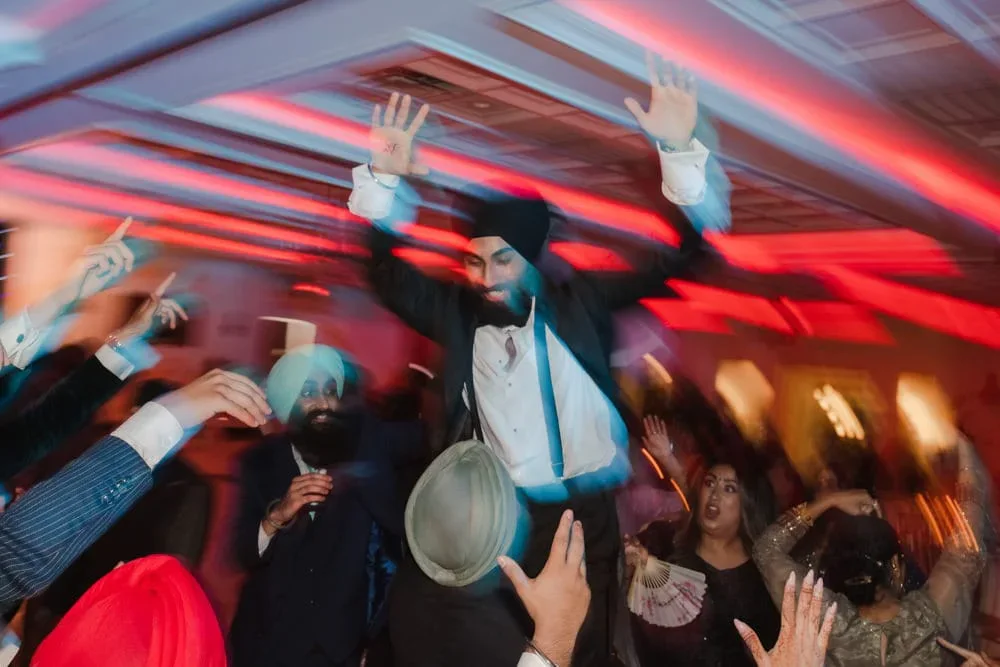 Newark Indian wedding DJ — Indian wedding couple reception entrance with professional DJ and lighting