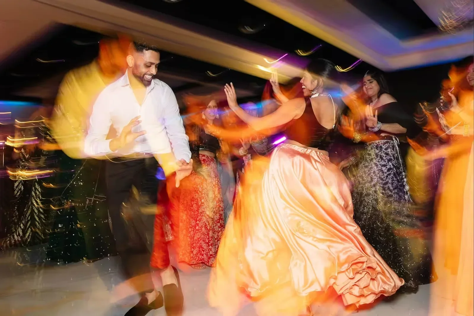 Indian, Pakistani & Punjabi wedding DJ and live dhol in Knoxville, TN, Desi Decibel Indian wedding DJ booth with intelligent lighting at a South Asian reception in Florida