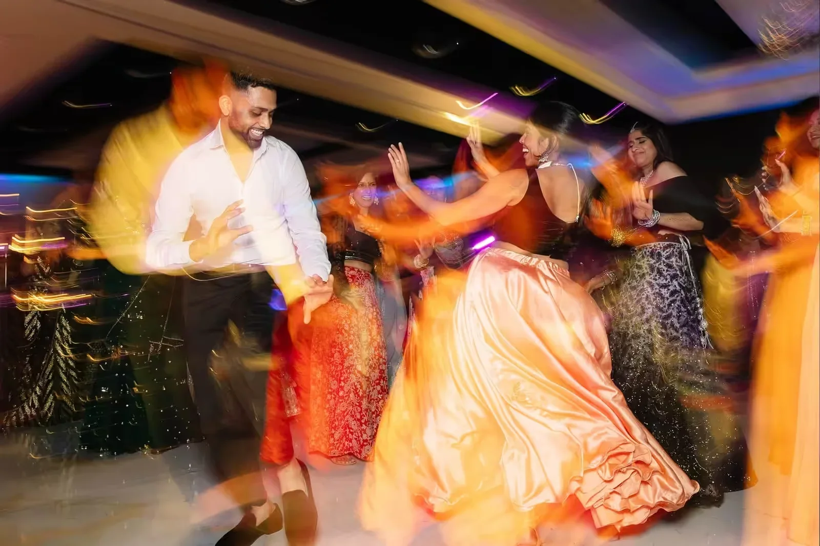 Cincinnati Indian wedding DJ — Desi Decibel Indian wedding DJ booth with intelligent lighting at a South Asian reception in Florida