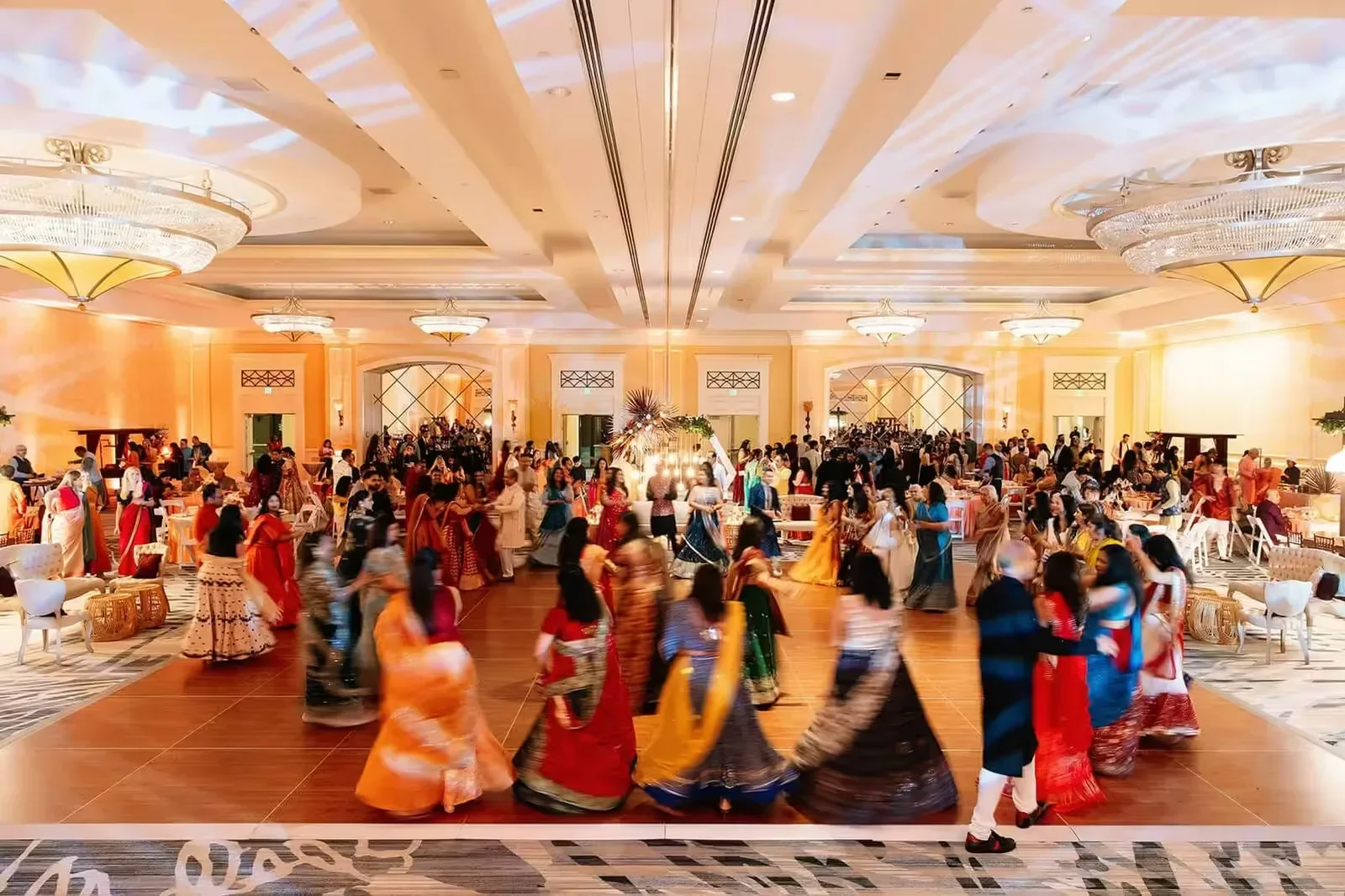Indian, Pakistani & Punjabi wedding DJ and live dhol in Augusta, GA, South Asian couple grand entrance on wedding dance floor with Desi Decibel DJ and uplighting